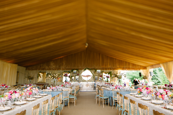 Stunning tented wedding reception with gold, blue and pink details - photo by Dan Stewart Photography